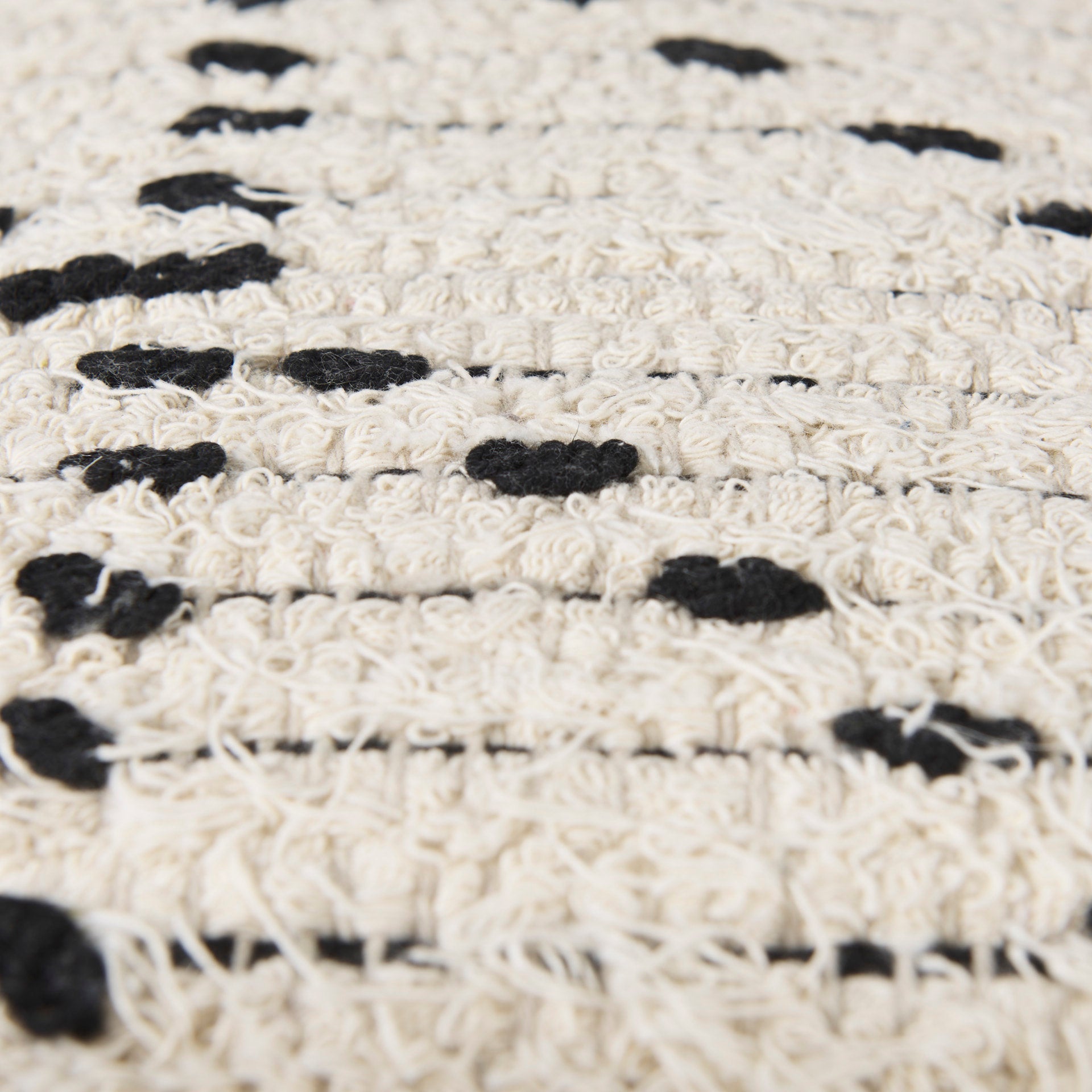 Aaohi Cream & Black Pouf