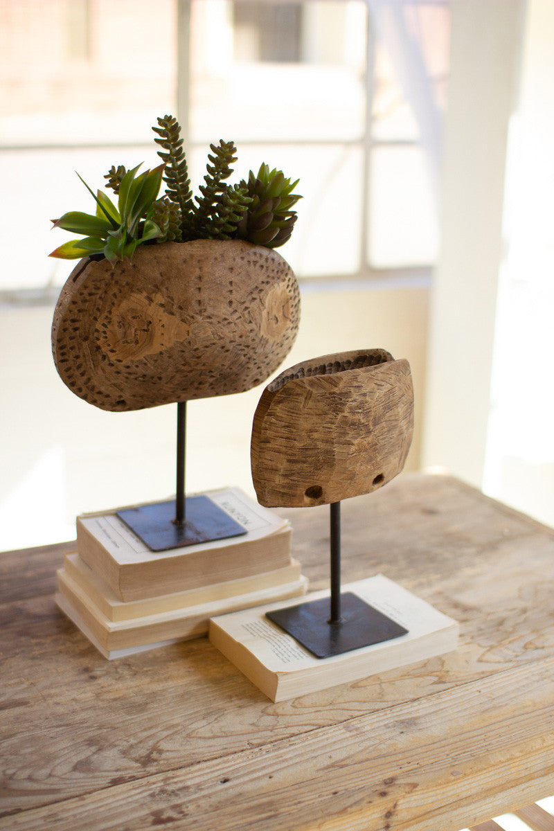 Repurposed Wooden Cow Bell Planters on Iron Stands